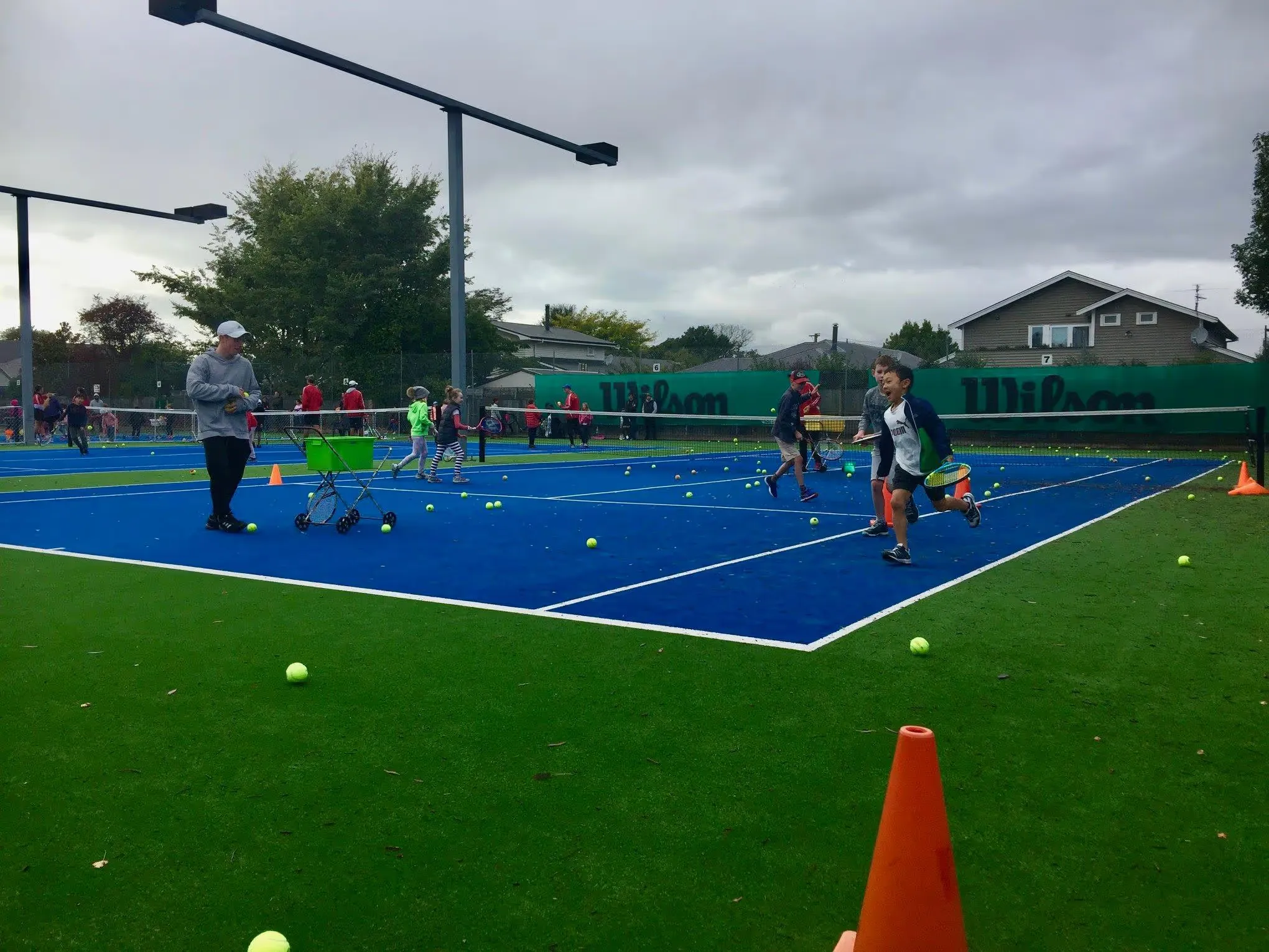 A junior coaching session taking place at the Waimairi Tennis Club - lots of fun and energy being used by these young players