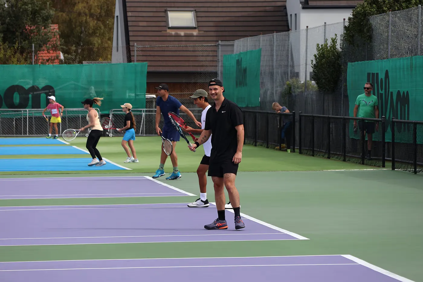 Tennis players on the courts during Saturday afternoon social play